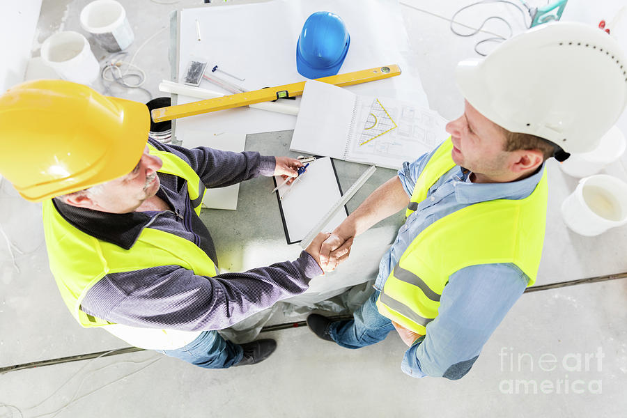 Architect and construction engineer handshake. #1 Photograph by Michal Bednarek