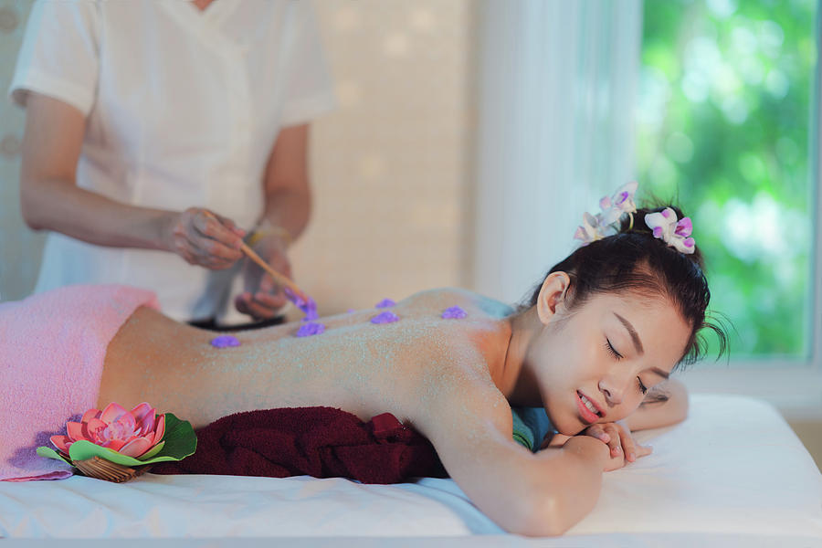 Asian lady relax in skin care aroma therapy  #1 Photograph by Anek Suwannaphoom