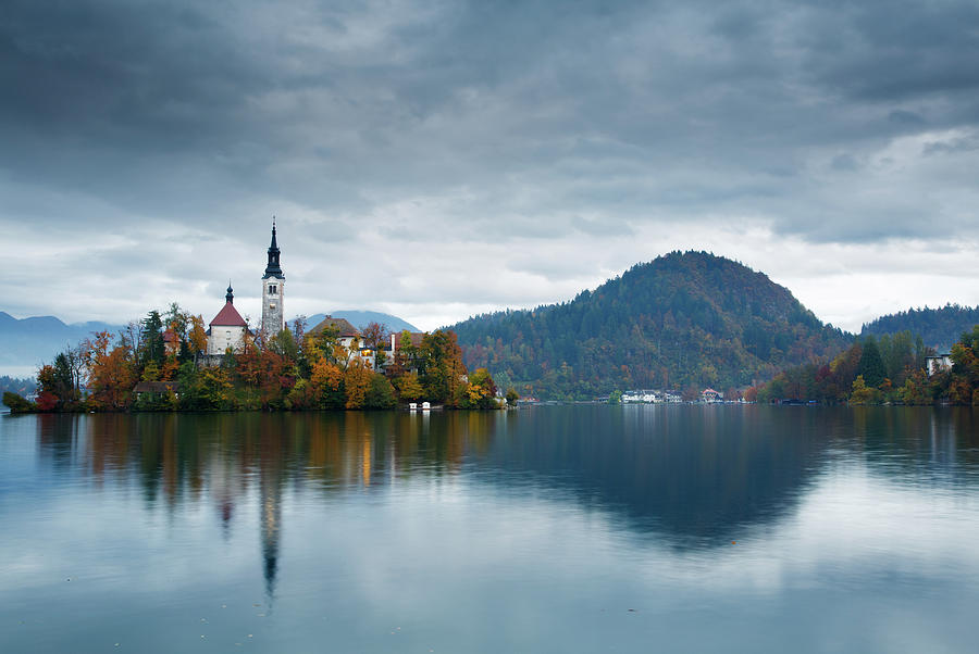 Mountain Photograph - Autumn colours at Lake Bled #1 by Ian Middleton