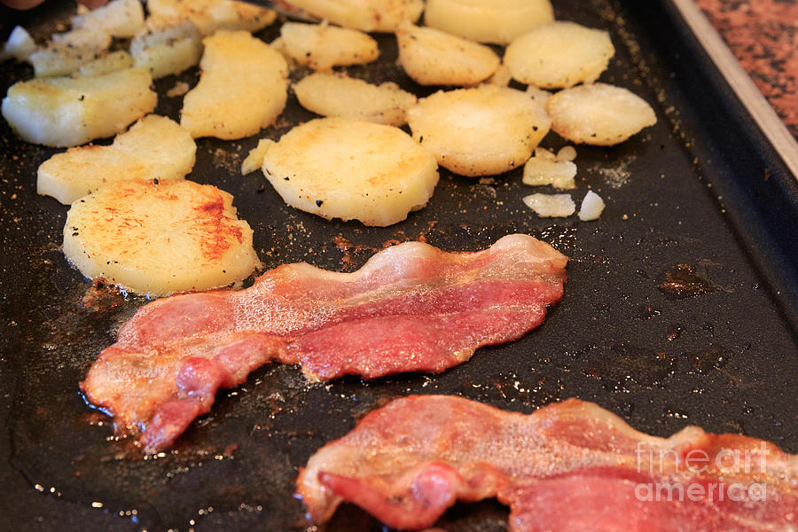 Bacon and potatoes on a griddle #1 Photograph by Louise Heusinkveld