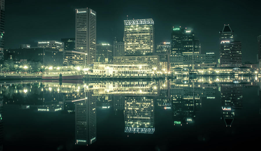 Baltimore  skyline and docks reflecting in the water at night #1 Photograph by Alex Grichenko