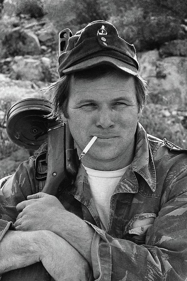Barry Sadler holding one of his numerous  machine guns  Tucson Arizona 1971 #2 Photograph by David Lee Guss