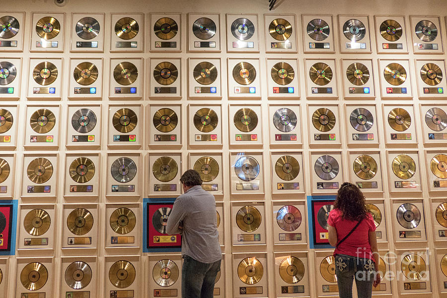 Looking at best selling  records Photograph by Patricia Hofmeester