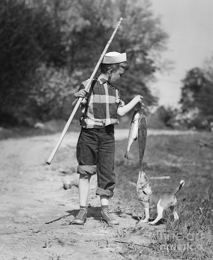 Fish Photograph - Boy With Fish Catch #1 by Debrocke/ClassicStock
