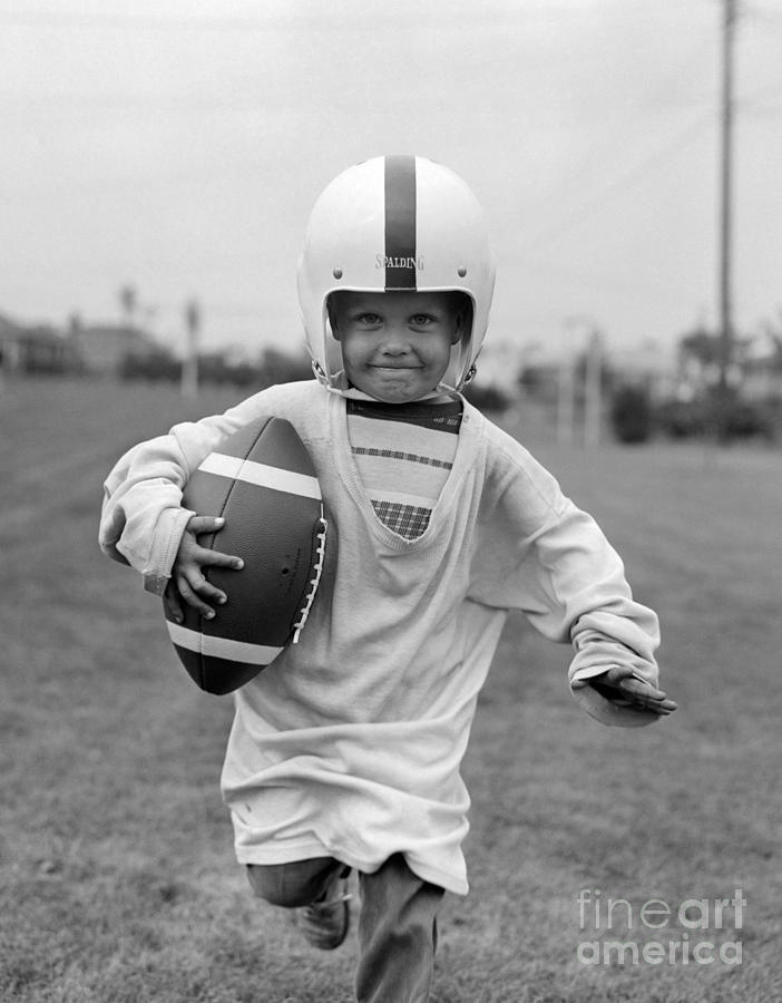 Boy With Oversized Football Gear, 1950s #1 Photograph by H. Lefebvre/ClassicStock