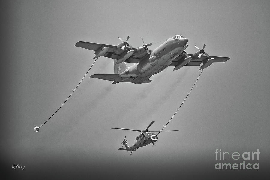 Sikorsky Blackhawk Befriends a C-130 Aircraft For Its Thirst  Photograph by Rene Triay FineArt Photos