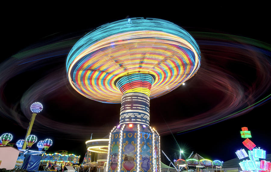 Carousel spinning fast #2 Photograph by Michalakis Ppalis