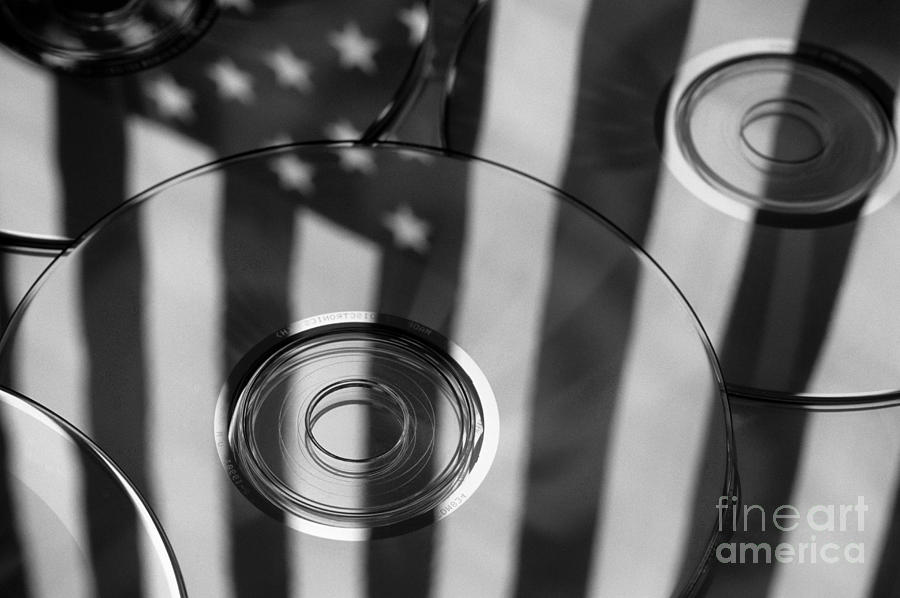 Cds Reflecting the American Flag  #1 Photograph by Jim Corwin