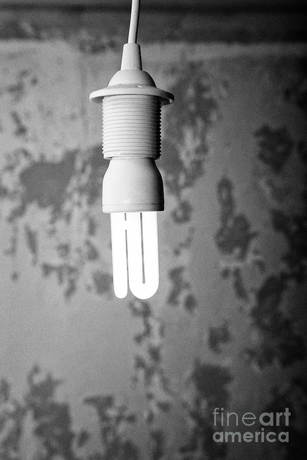 Cfl Compact Fluorescent Energy Saving Lightbulb Burning In A Derelict