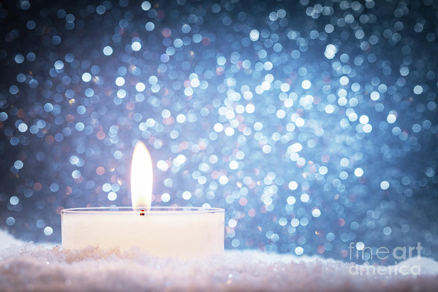Chistmas candle glowing on glitter background. #1 Photograph by Michal Bednarek