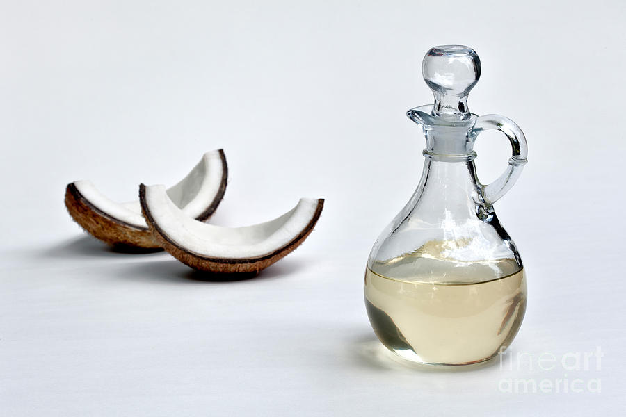 Coconut Oil In Glass Carafe #1 Photograph by Inga Spence