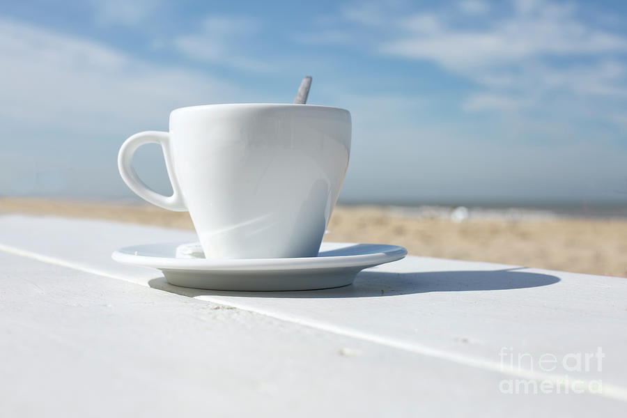 Drinking coffee on the beach Photograph by Patricia Hofmeester