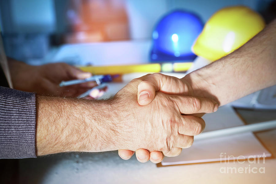 Construction engineers handshake. #1 Photograph by Michal Bednarek