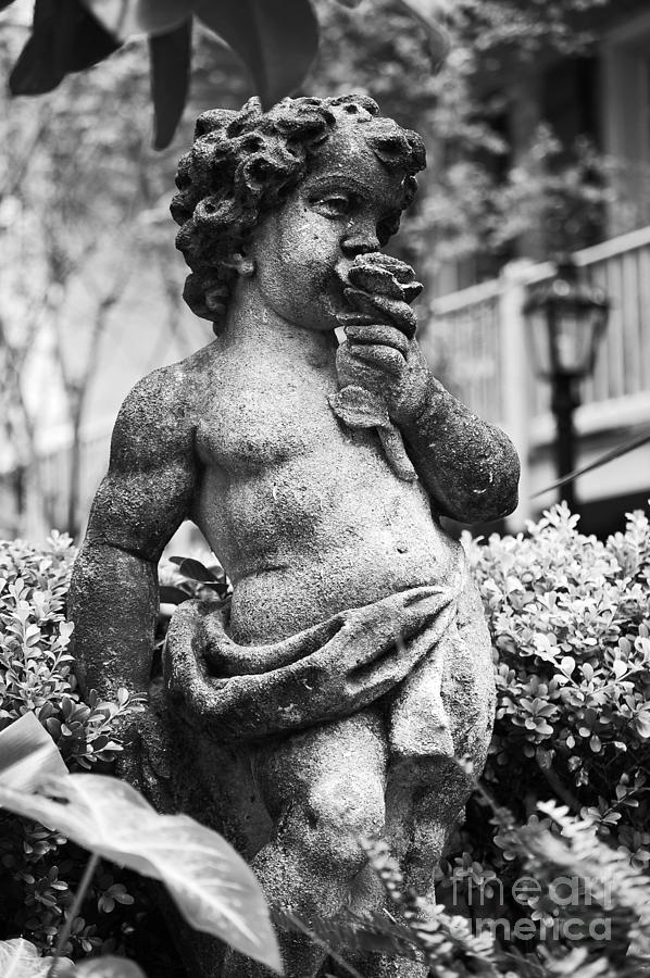 Courtyard Statue of a Cherub French Quarter New Orleans Black and White Photograph by Shawn OBrien