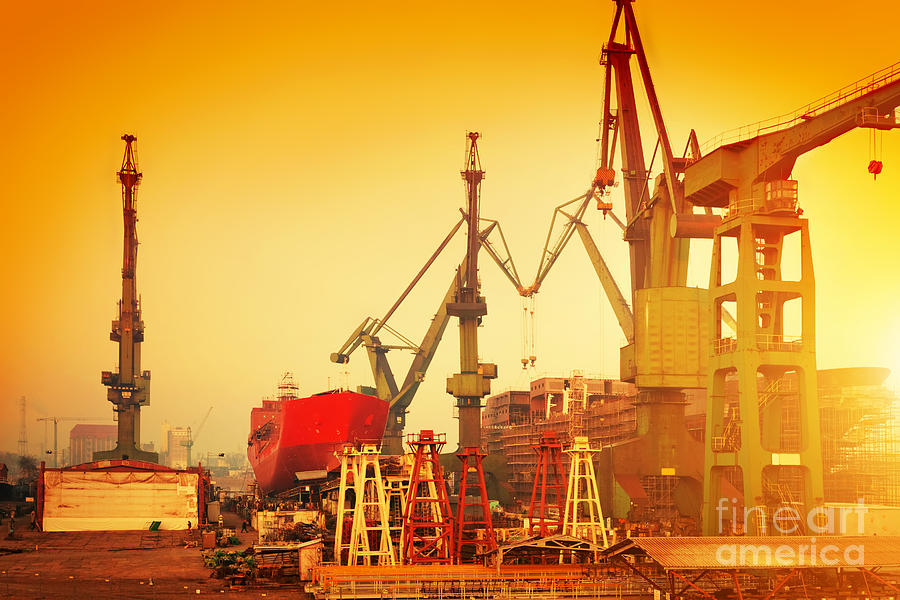 Cranes in historical shipyard in Gdansk #1 Photograph by Michal Bednarek