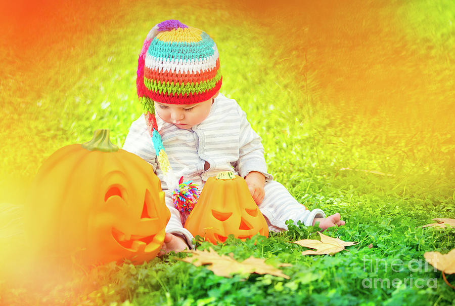 Cute baby playing with Halloween pumpkins #1 Photograph by Anna Om