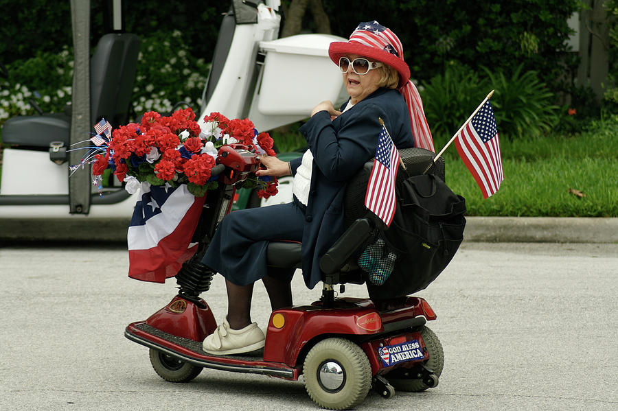 Flower Photograph - Patriotic lady on a scooter by Carl Purcell