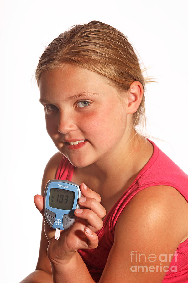 Diabetic Child With Blood Glucose Tester #1 Photograph by Ted Kinsman