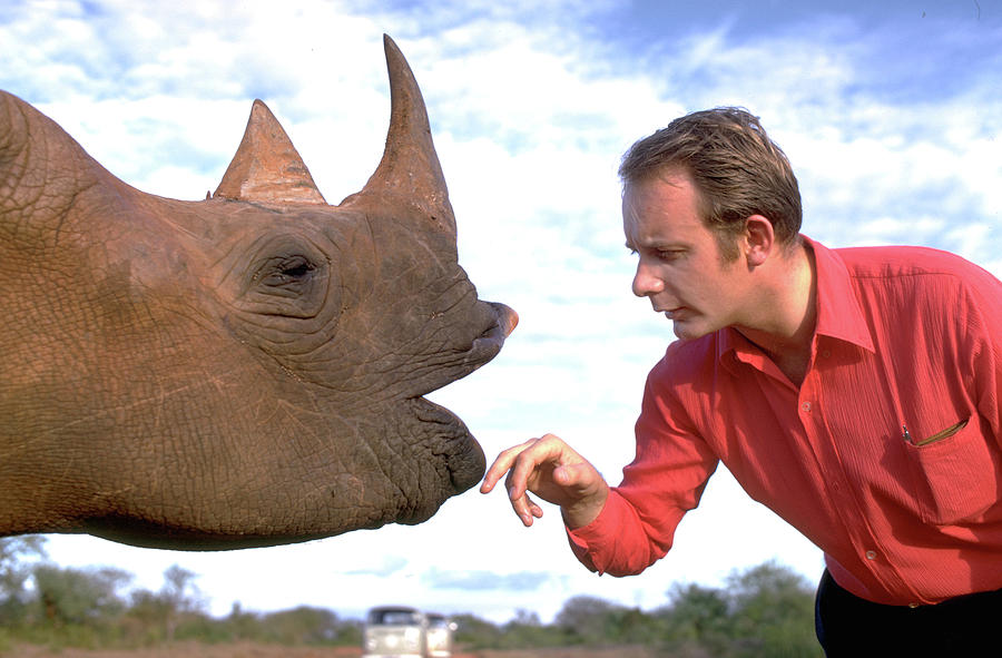 Wildlife Photograph - Making Friends with a Rhino by Carl Purcell