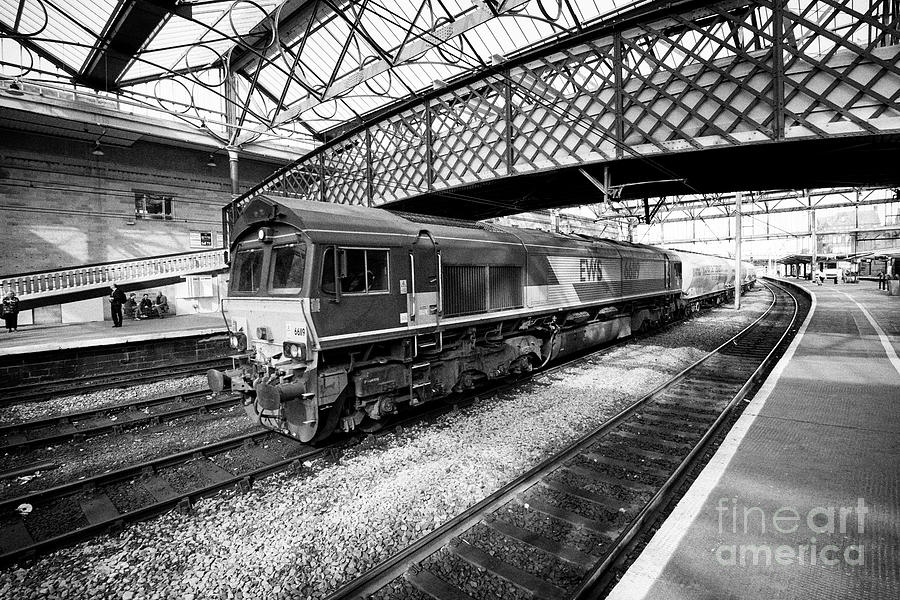 Transportation Photograph - EWS diesel electric locomotive freight train passing through Carlisle railway train station Carlisle #1 by Joe Fox
