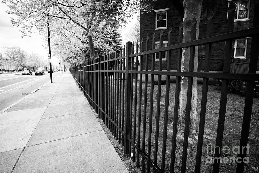 Boston Photograph - exterior enclosing metal fence residents only housing complex Boston USA #1 by Joe Fox