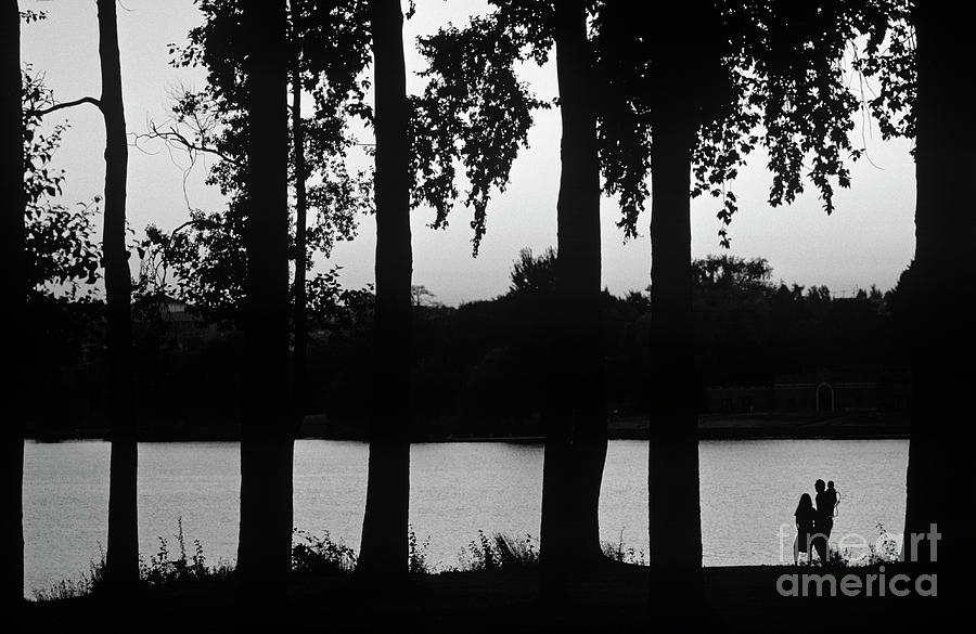 Family Silhouetted by Lake #1 Photograph by Jim Corwin
