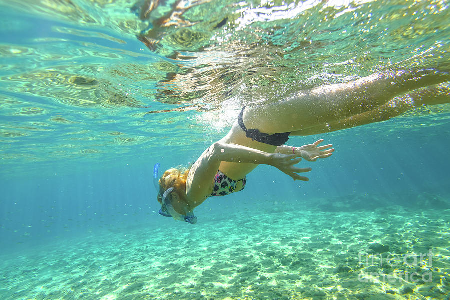 Female apnea underwater #1 Photograph by Benny Marty
