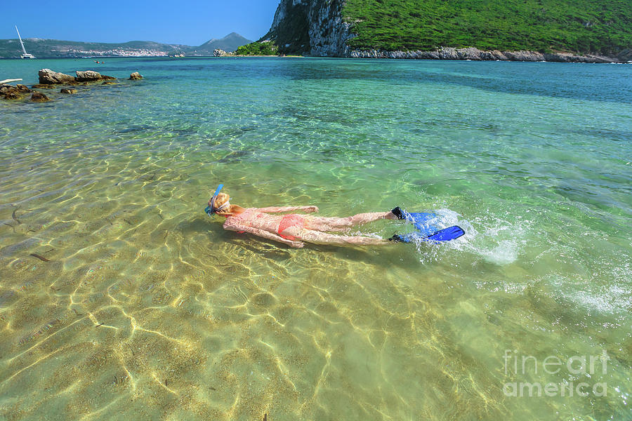 Female bikini snorkeler #1 Photograph by Benny Marty
