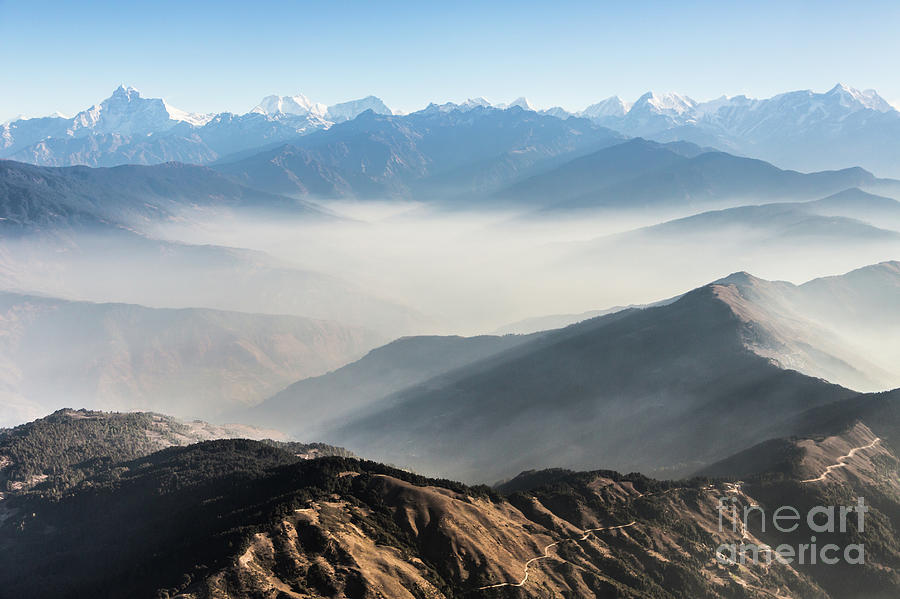 Flying above the clouds in the Himalayas in Nepal #1 Photograph by Didier Marti