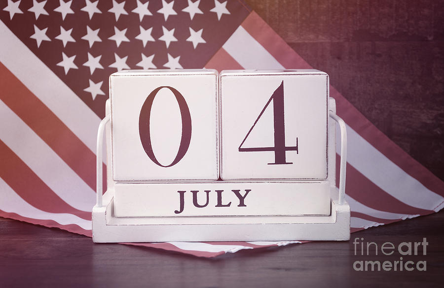 Fourth of July vintage wood calendar with flag background.  #1 Photograph by Milleflore Images