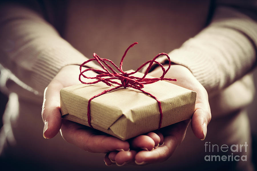 Giving a gift, handmade present wrapped in paper #1 Photograph by Michal Bednarek