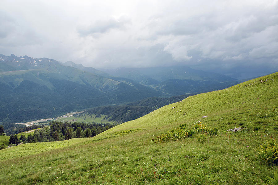 Green Slope Of A High Mountain During A Thunderstorm With Clouds ...