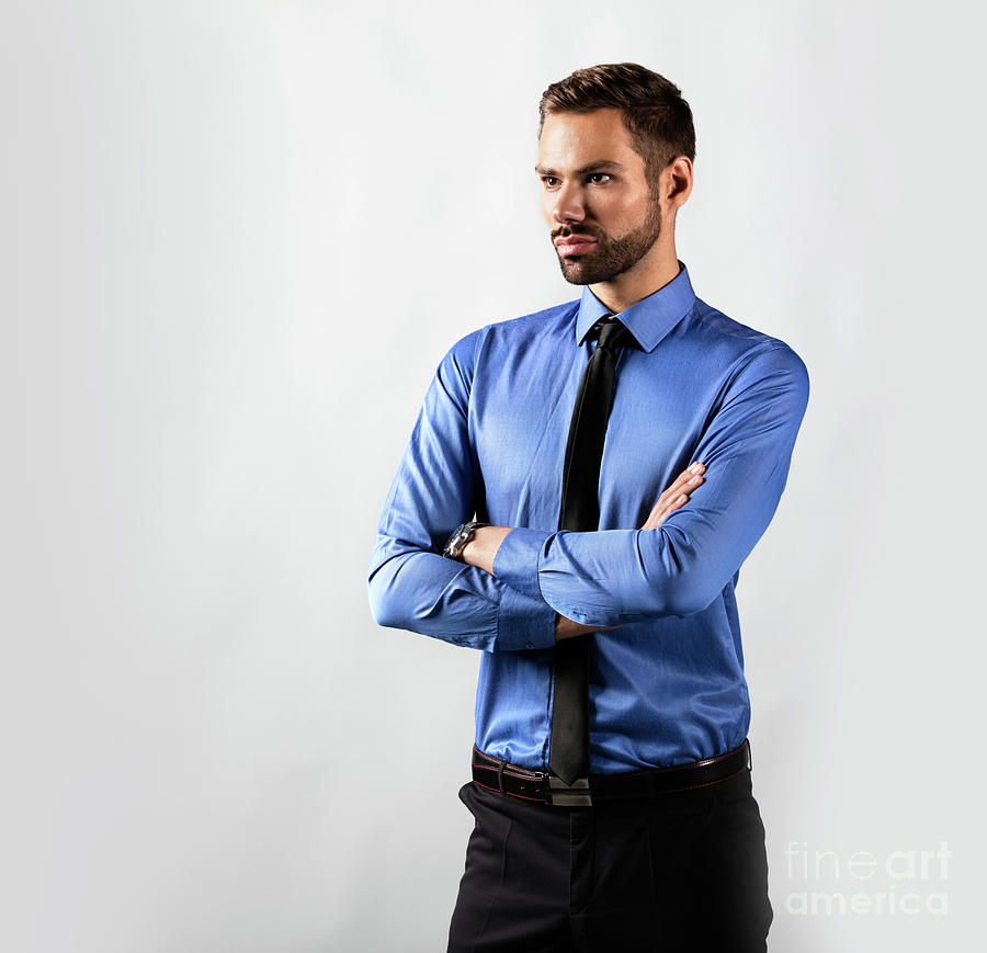 Handsome young businessman standing confident. Isolated on white #1 Photograph by Michal Bednarek