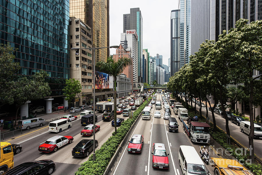 Heavy traffic on the road between the Wan Chai and Causweay Bay  #1 Photograph by Didier Marti
