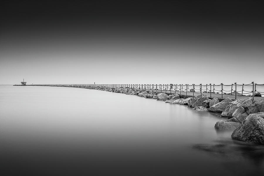 Black And White Photograph - Herne Bay Neptunes Arm  #1 by Ian Hufton