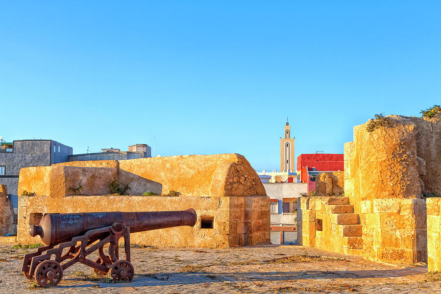 historic guns standing in the old historic portuguese fortress city El Jadida in Morocco #1 Photograph by Gina Koch