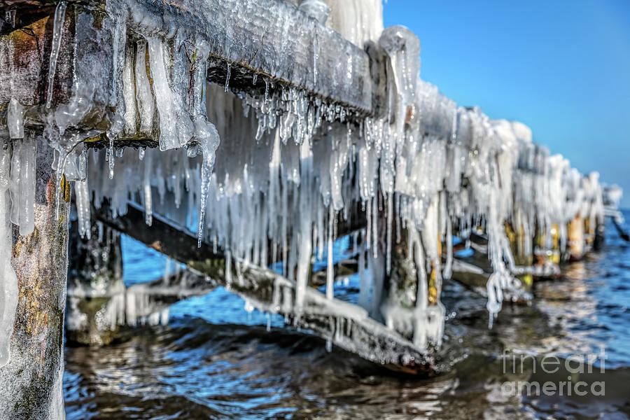 Icicle hanging under jetty roof. Ice, winter. #1 Photograph by Michal Bednarek