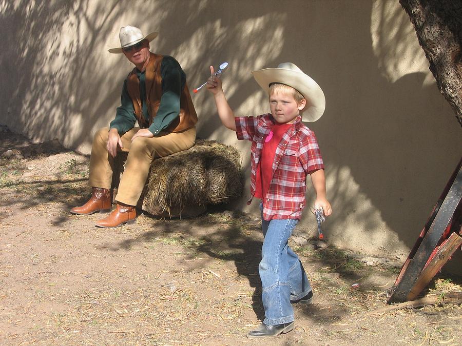 Junior Gunslinger With Doting Dad O.k. Corral Gunfight Site Tombstone Arizona 2004 #1 Photograph by David Lee Guss