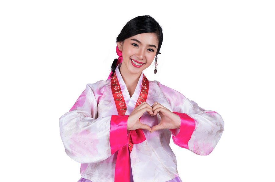 Korean lady show symbol of love by hand and Korea original dress #1 Photograph by Anek Suwannaphoom