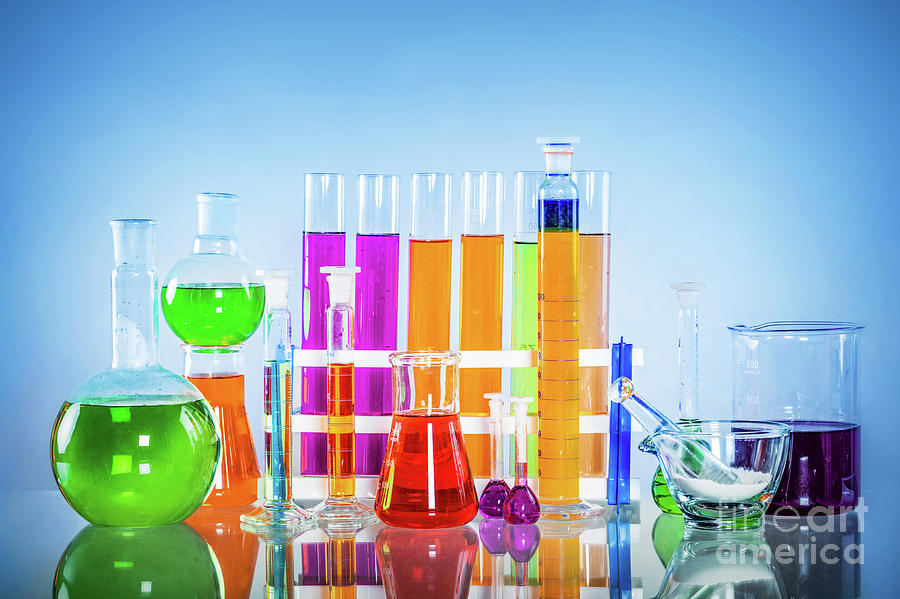 Laboratory glass set filled with colorful substances. #1 Photograph by Michal Bednarek