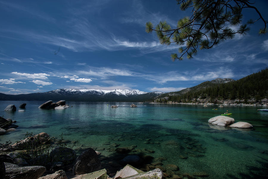 Lake Tahoe scene with puffy clouds and snow on mountains #1 Photograph by Dan Friend