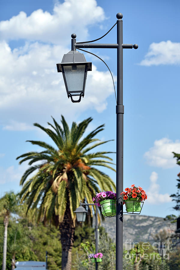 Lampost with flowers in Nafplio town #1 Photograph by George Atsametakis