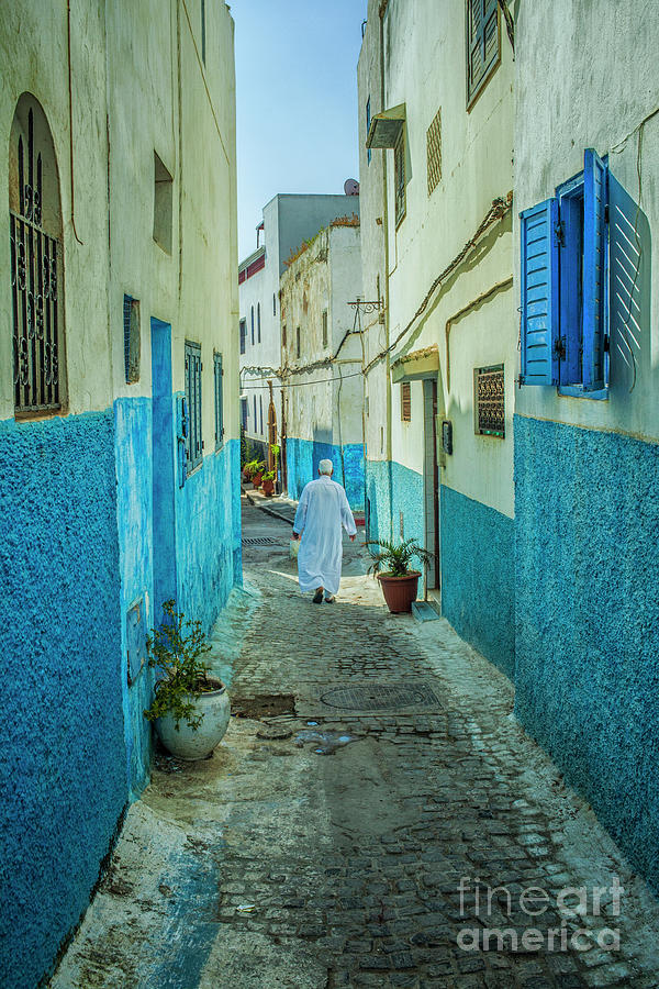 Man in djellaba walking in medina of Rabat Photograph by Patricia Hofmeester