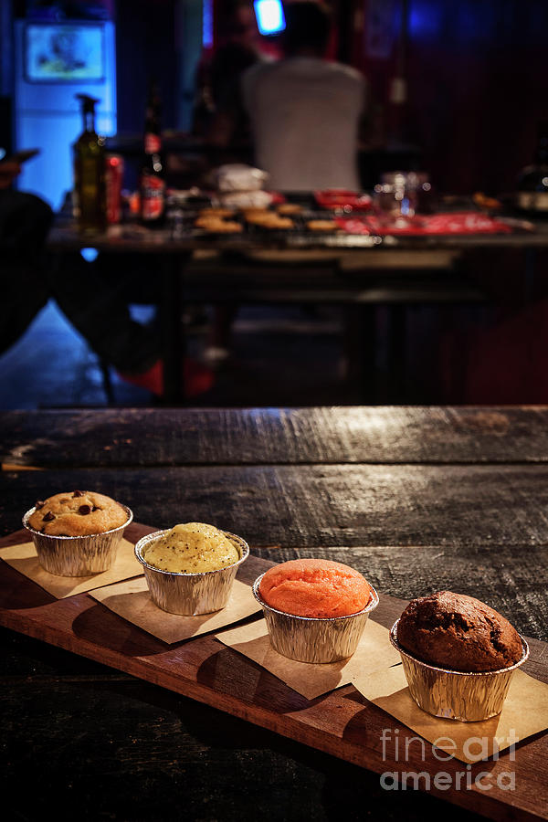 Mixed Freshly Baked Muffins In Cozy Coffeeshop Interior #1 Photograph by JM Travel Photography