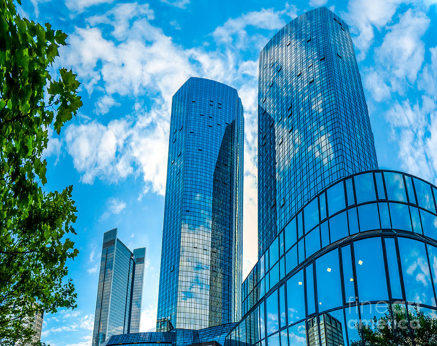 Modern Skyscrapers In Business District Against Blue Sky Photograph