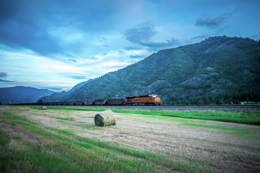 Montana landscapes with heavy train engine locomotive passing #1 Photograph by Alex Grichenko