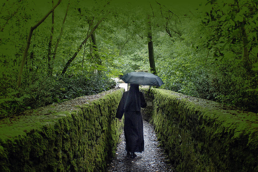 Nun in the Rain #1 Photograph by Don Wolf