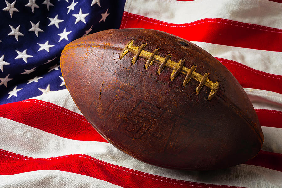 Old Football On American Flag #1 Photograph by Garry Gay
