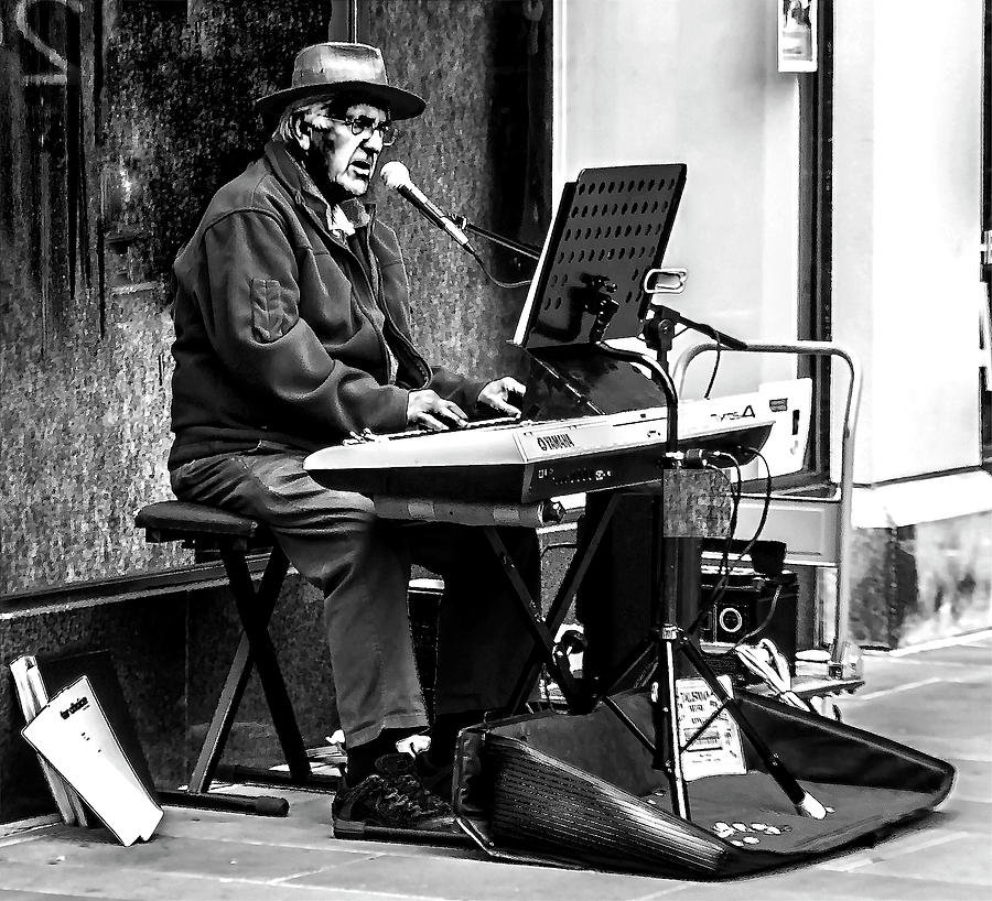 Old man playing an organ #2 Photograph by Ian Watts