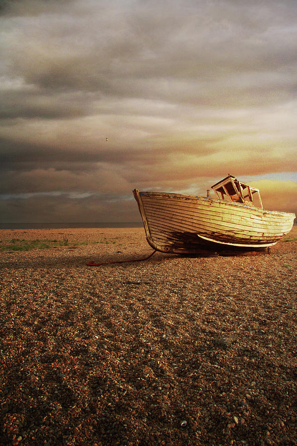 Old Wooden Boat Washed Up On A Beach Photograph by Ethiriel Photography